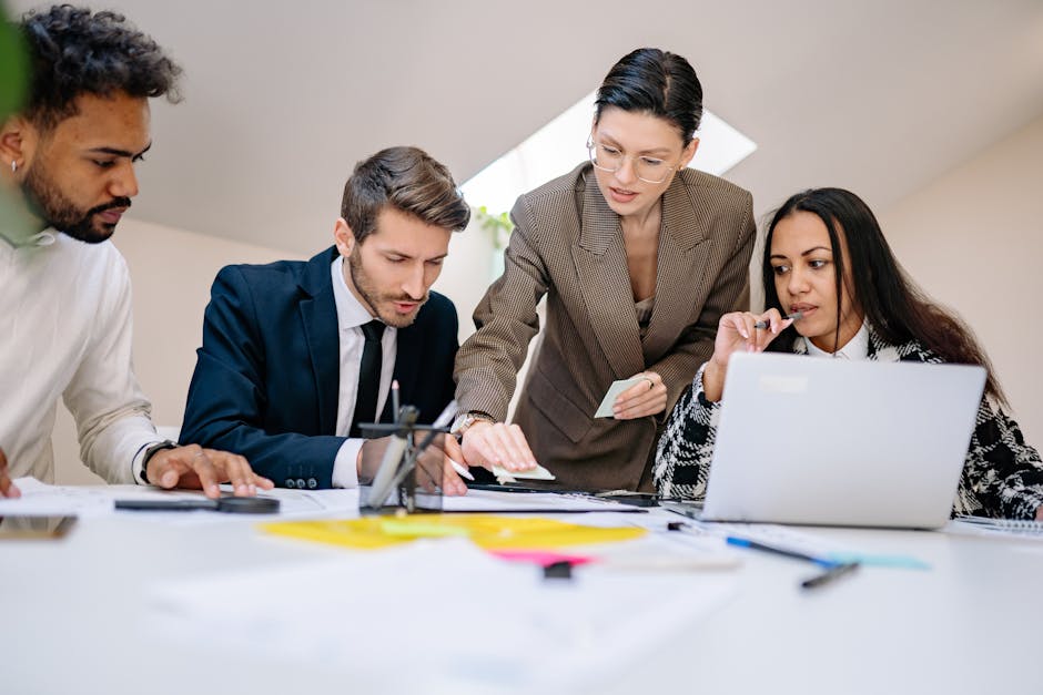 Business team working together at desk with documents